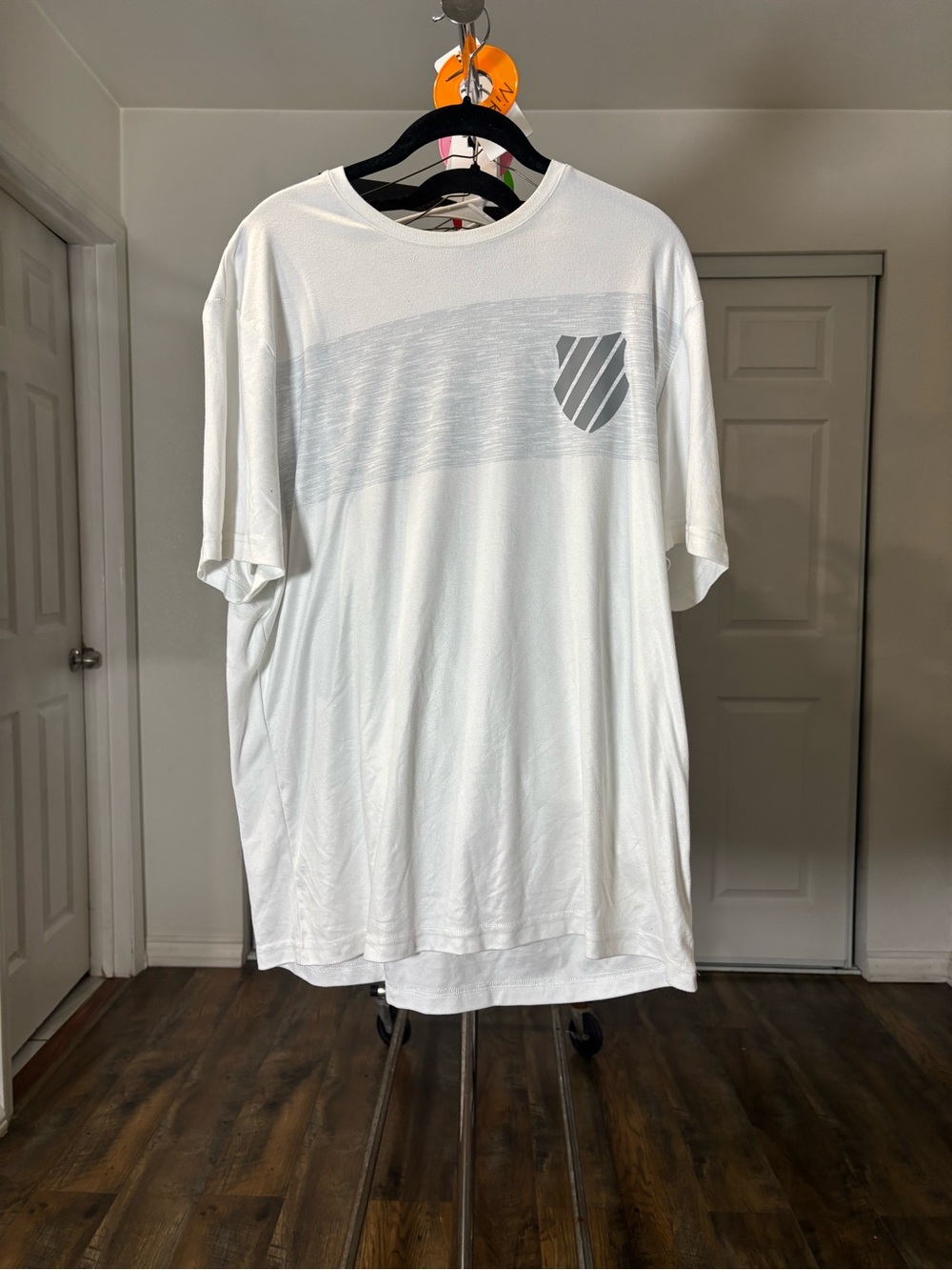 Men's White Short-Sleeve Crew Tee with Subtle Gray Shield Graphic